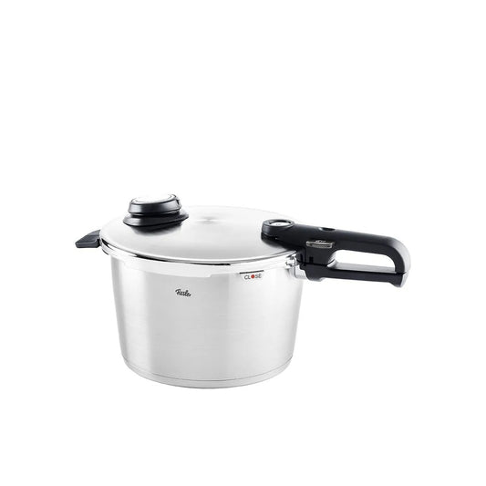 Stainless steel pressure cooker with black handles on a white background