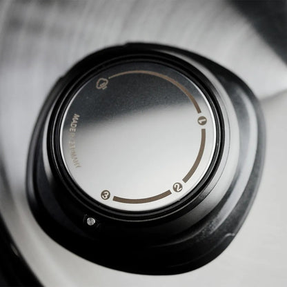 Close-up of a camera lens with a blurred background