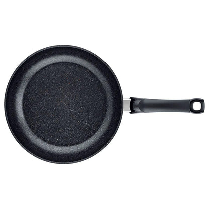Black frying pan with a handle on a white background