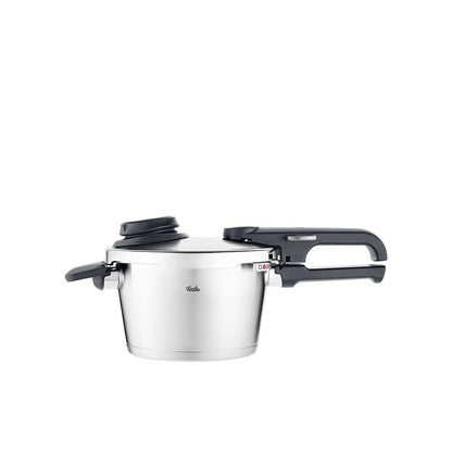 Stainless steel pressure cooker with black handle on a white background
